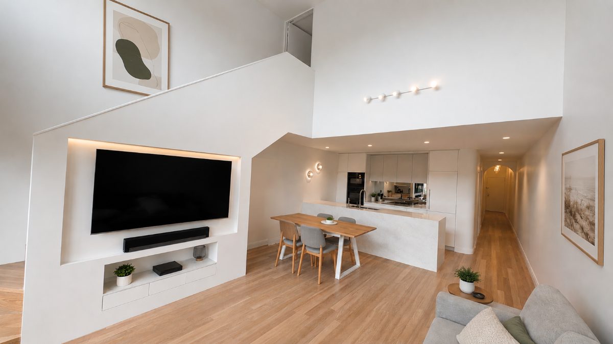 Double-height living area with integrated TV joinery and kitchen in an Alexandria townhouse renovated by Armessen Build